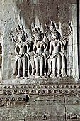 Angkor Wat temple, second enclosure, devatas sculpted in bas-relief with an extraordinary variety of intricate hair styles and costumes.